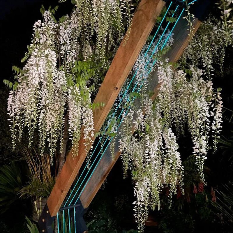 Wisteria-at-night-with-neon-knitted-tubes